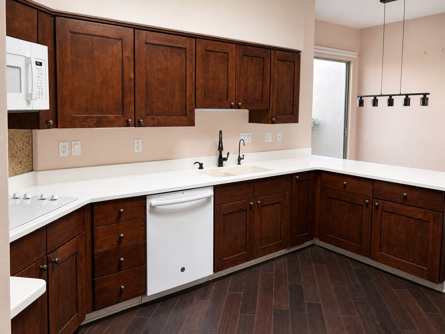 Scottsdale kitchen dark wood cabinetry before architectural film installation
